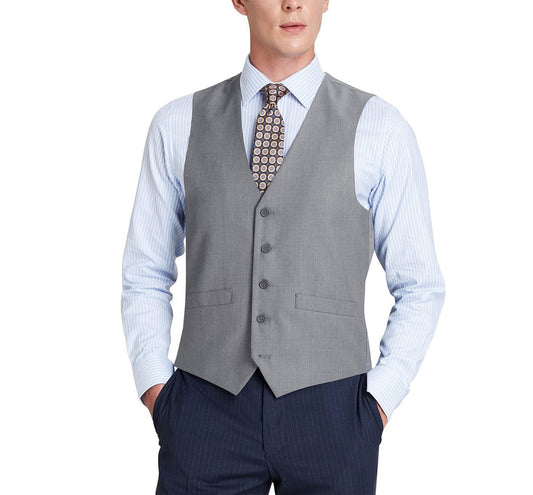 A man dressed in an Alessandro Vitello by Renoir Grey Button Formal Suit Vest over a striped shirt and patterned tie, with his hands in his pockets. This regular fit suit waistcoat, crafted from a polyester viscose blend by Renoir, combines comfort and style.