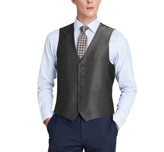 A person wearing a Renoir Alessandro Vitello black formal regular fit sharkskin waistcoat over a light blue striped shirt with a patterned tie, hands comfortably in pants pockets.