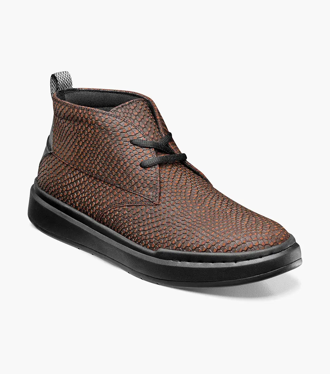 Stacy Adams - CAI Plain Toe Chukka Boot in brown, product code 25566-200, showcases a textured design with a black sole and is photographed on a white background. The boot includes a cushioned insole for enhanced comfort.