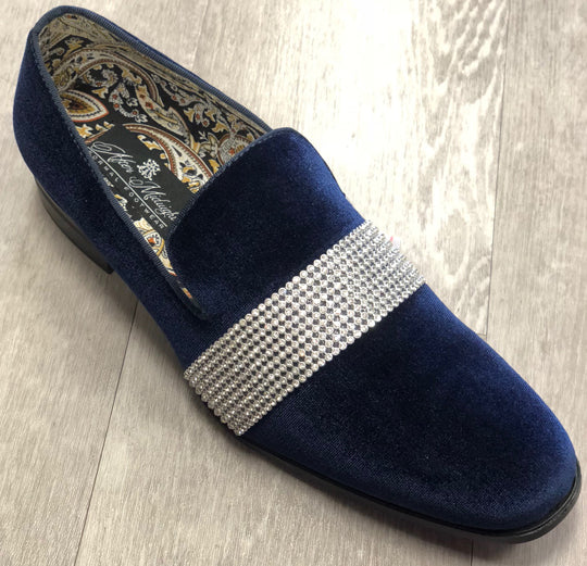 The After Midnight Formal Shoe 6715 Navy by AFTER MIDNIGHT is a velvet loafer with a rhinestone band, featuring a paisley-patterned lining, showcased on a light wood floor.