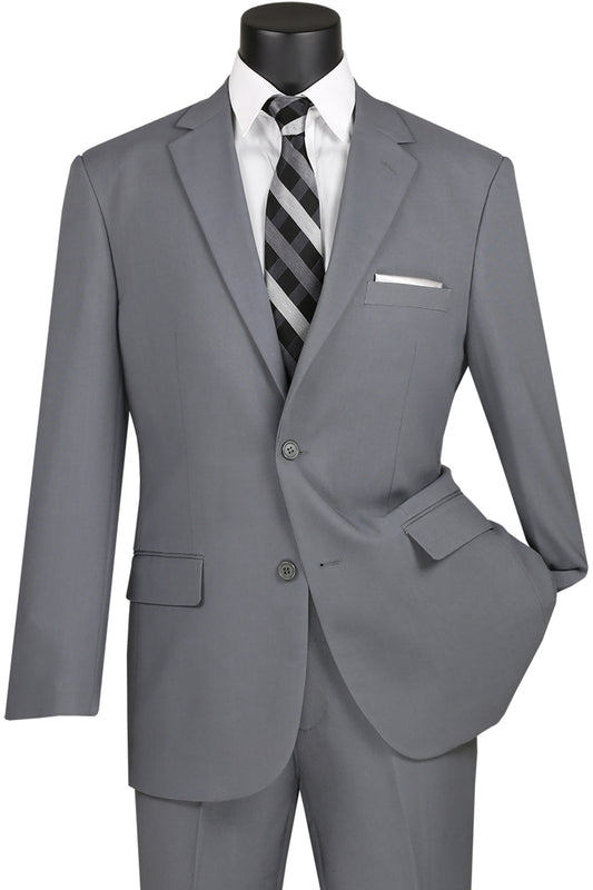 The Vinci Single Breasted Poplin Dacron Suit in medium gray by Vinci Suits, paired with flat front pants and a black-and-gray striped tie, is elegantly displayed on a mannequin.