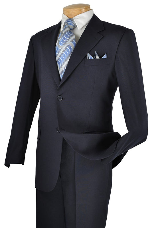 A mannequin elegantly displays the Vinci Single Breasted Poplin Dacron Suit in Navy by Vinci Suits, featuring flat front pants and a light blue patterned tie with a matching pocket square, perfectly complementing the 2-button, single-breasted look.