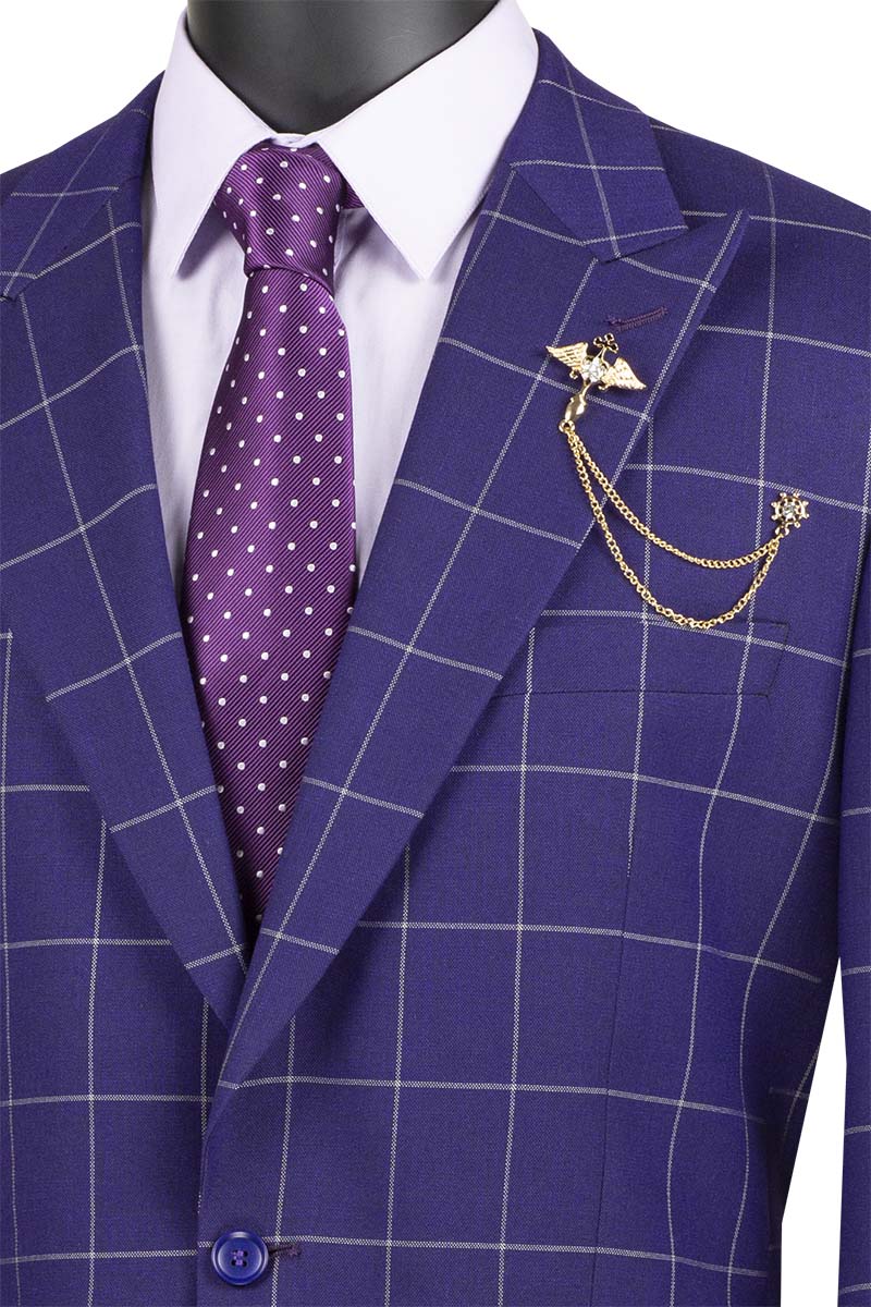 A torso mannequin showcases the Vinci Executive 2 Piece Windowpane Suit in purple, featuring a blazer and pants, paired with a matching polka dot tie and decorative lapel chain.