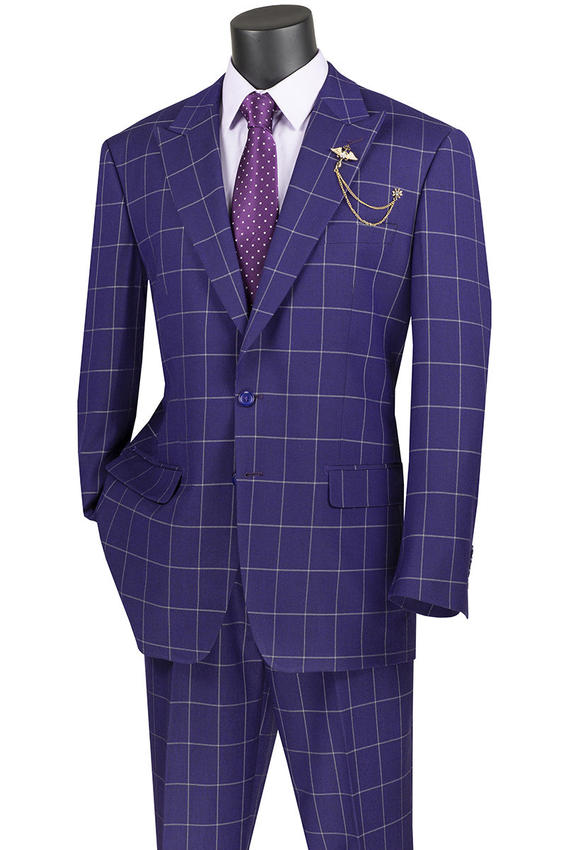 A torso mannequin showcases the Vinci Executive 2 Piece Windowpane Suit in purple, featuring a blazer and pants, paired with a matching polka dot tie and decorative lapel chain.