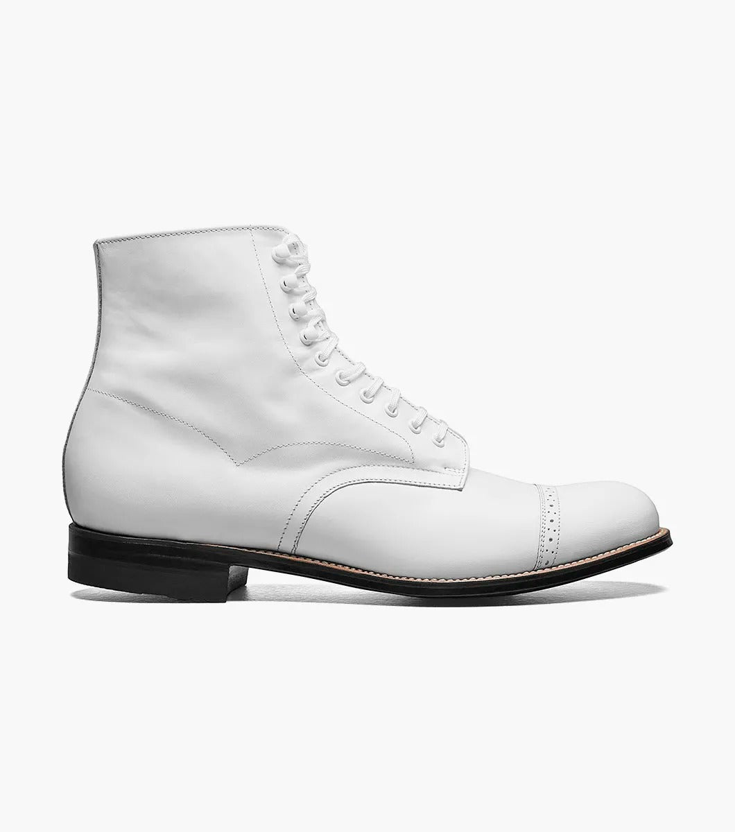 The Stacy Adams MADISON Cap Toe Boot in white is a kidskin leather lace-up boot with a cap toe and black sole, designed using Goodyear welted construction for long-lasting durability.