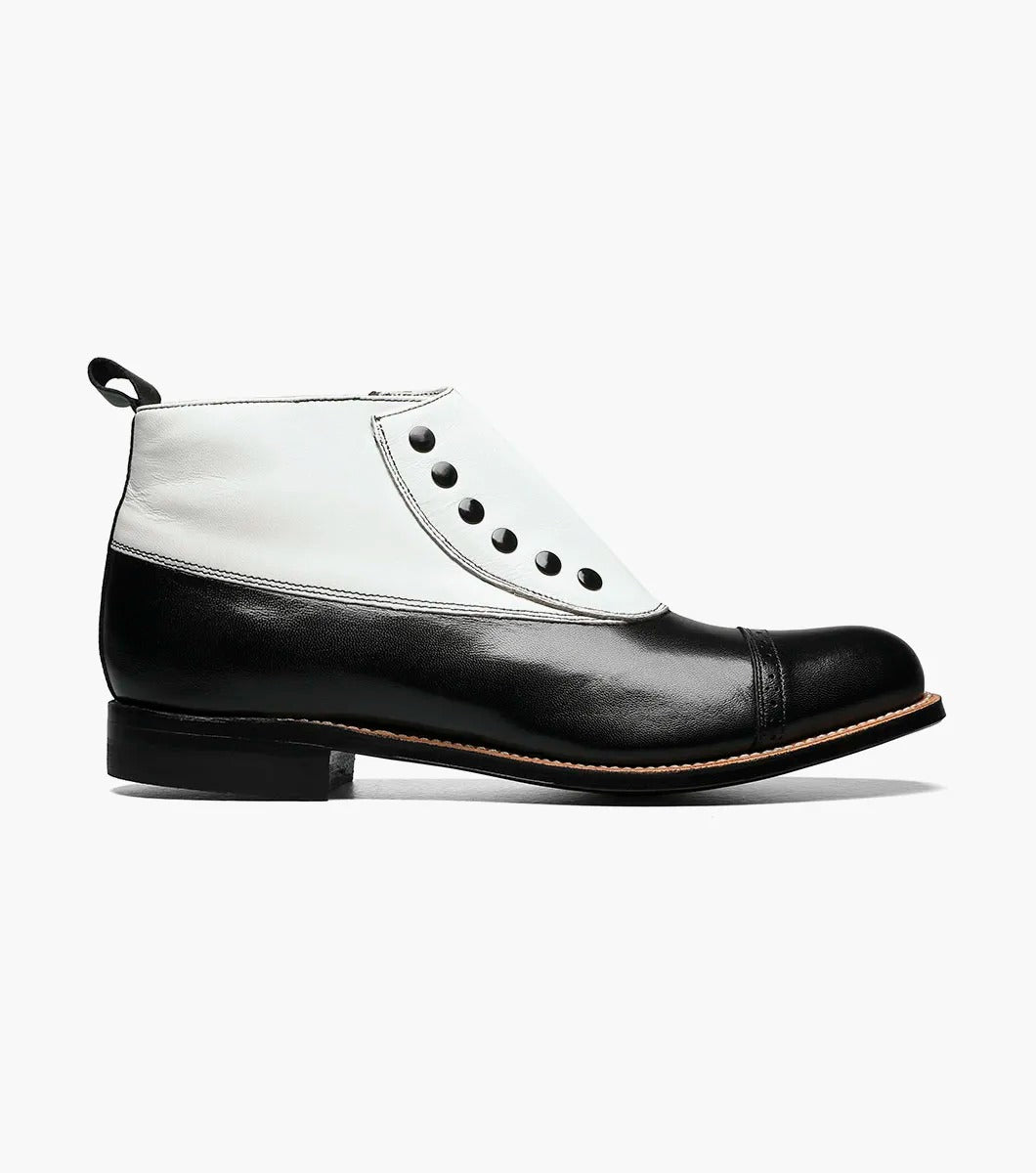 Explore the Stacy Adams MADISON Spectator Spat Cap Toe Boot, featuring a sophisticated black and white button-up ankle design crafted from premium kidskin leather. This boot, offered by STACY ADAMS, is constructed with a Goodyear welt for durability, boasts a polished finish, and includes a low heel that exudes timeless elegance.