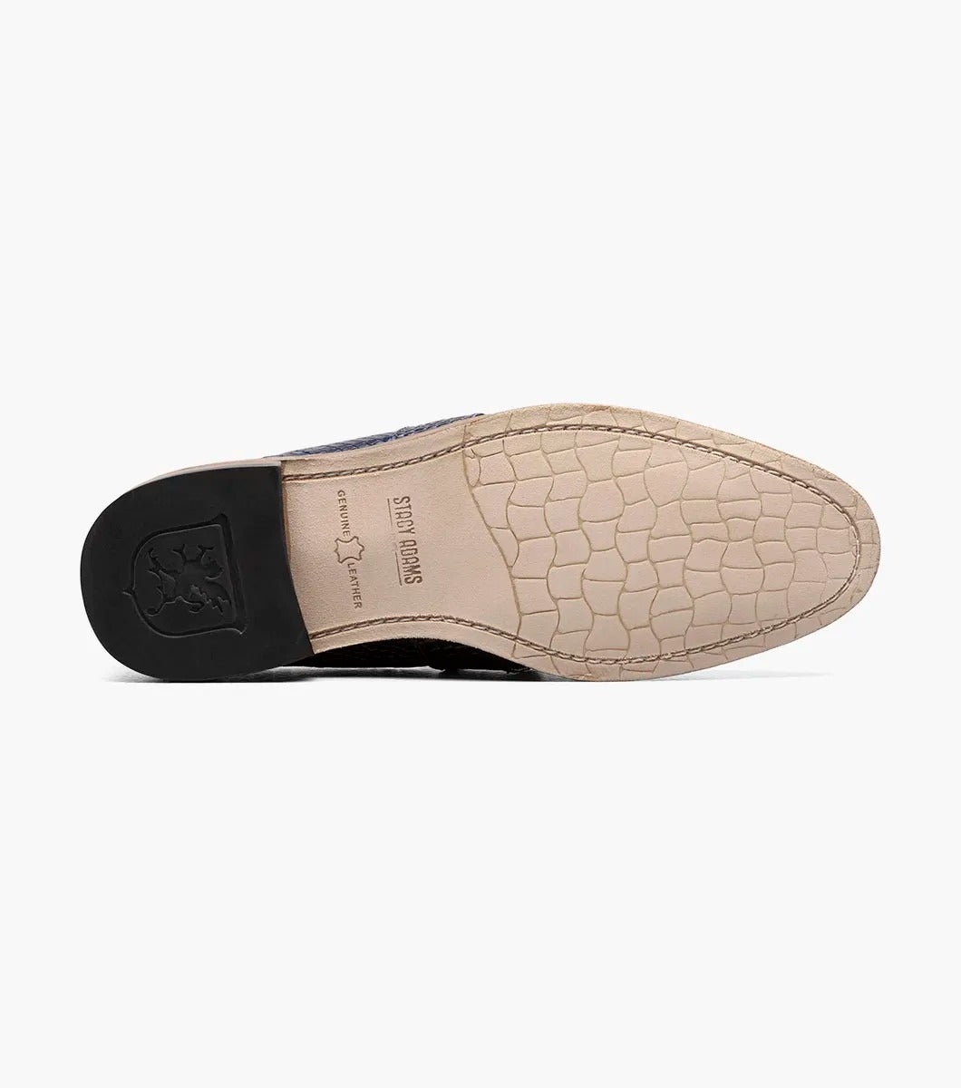 The Stacy Adams PACETTI Leather Sole Moc Toe Tassel Slip On in blue features a textured design with a memory foam insole and a brown sole.