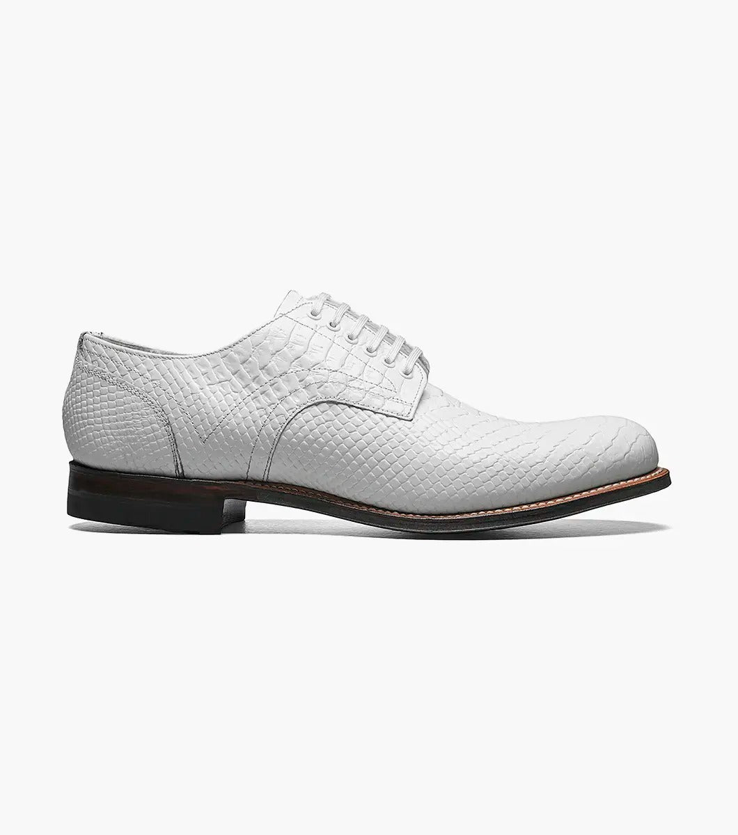 A Stacy Adams MADISON Anaconda Plain Toe Oxford in white, made with textured leather and laces, showcases a low heel and dark sole. It features Goodyear welt construction and is photographed against a white background.