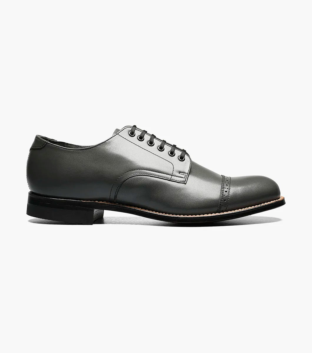 A side view of the Stacy Adams MADISON Cap Toe Oxford in steel gray, crafted from kidskin leather, featuring a cap-toe design with laces and Goodyear welt construction.