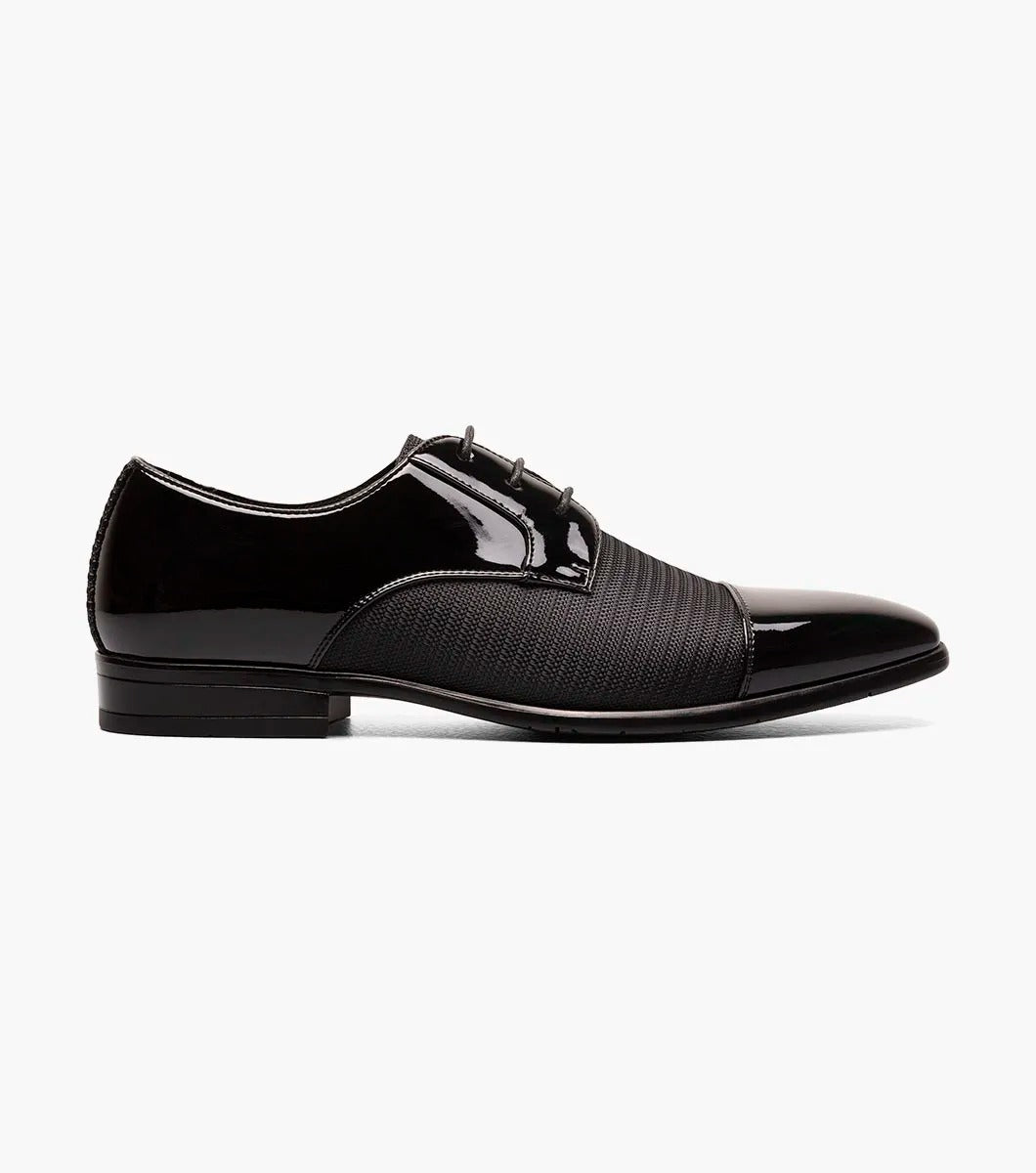 Introducing the Stacy Adams - PHARAOH Cap Toe Oxford in black, a striking formal dress shoe made with polished patent leather and a textured fabric upper. Its lace-up style guarantees an elegant appearance for any event.