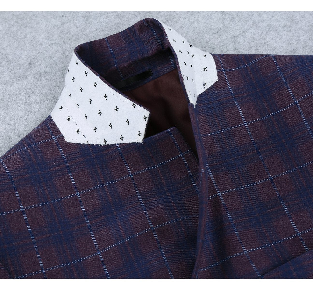 The Alessandro Vitello by Renoir Purple 2 Buttons Slim Fit Premium Plaid Sport Coat 294-3 is a sleek menswear piece that blends classic style with modern flair. It features a stylish blue and burgundy plaid check pattern, two-button closure, two front pockets, and an elegant pocket square.