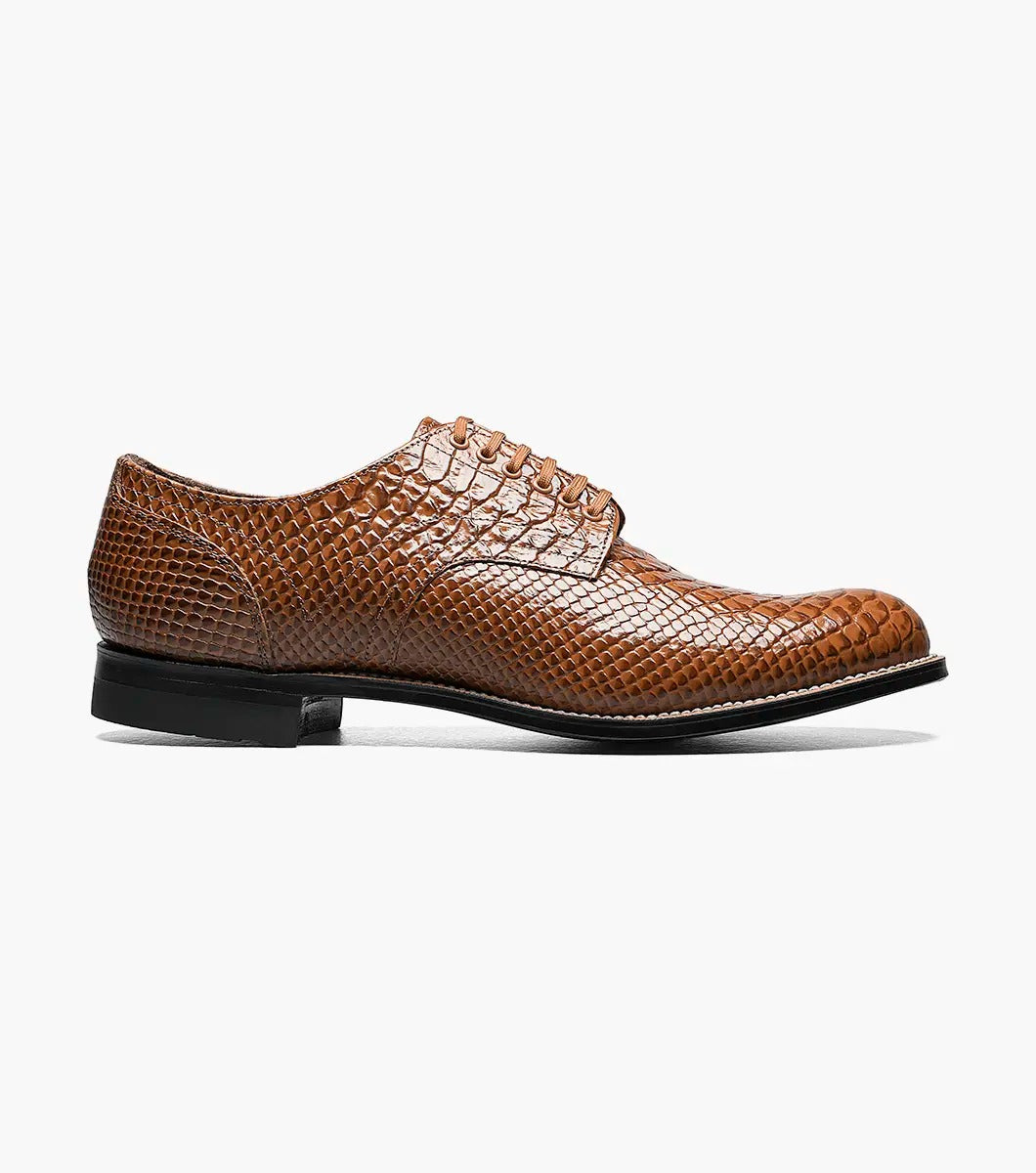 The Stacy Adams - MADISON Anaconda Plain Toe Oxford in tan showcases a lace-up design with a textured anaconda print on brown leather, genuine welt construction, and is complemented by a black sole.