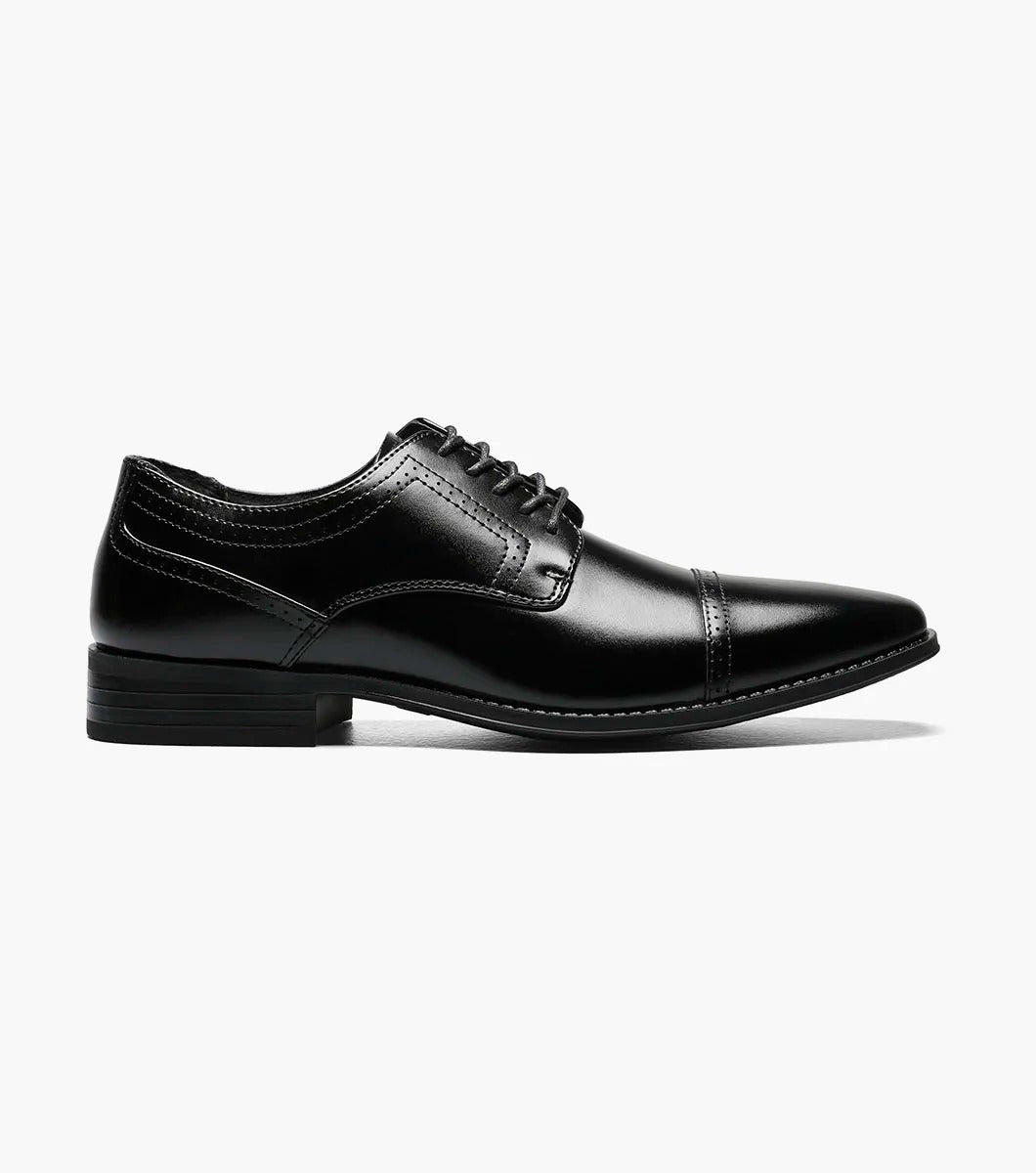 The Stacy Adams WALTHAM Cap Toe Oxford in black (model 20138-001) is a stylish leather dress shoe featuring laces, a sleek cap toe design, and elegant decorative stitching. The low heel and dress style rubber sole ensure modern comfort while maintaining timeless sophistication.