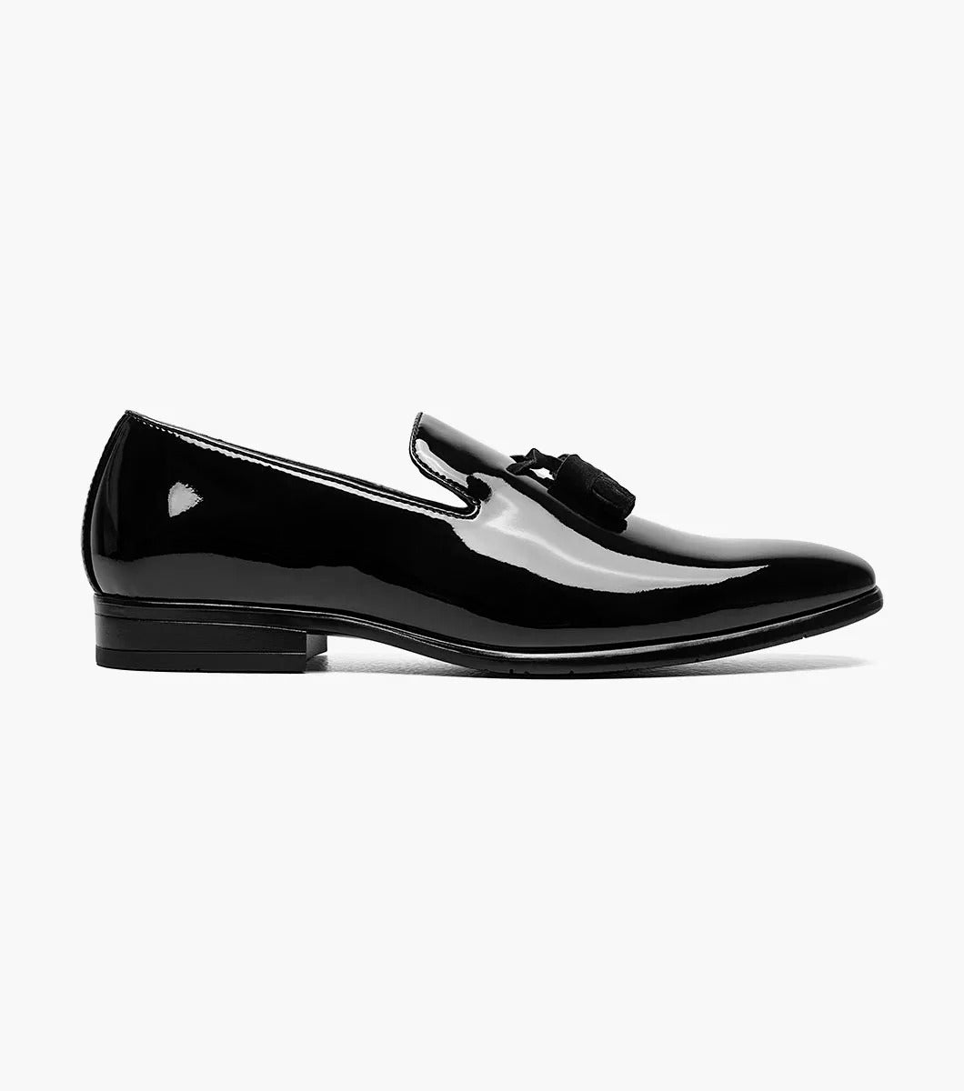 The Stacy Adams PHOENIX Plain Toe Tassel Slip On (Black Patent - 21011-004) is a stylish black loafer crafted with a polished patent upper and low heel, enhanced by a memory foam footbed for superior comfort.