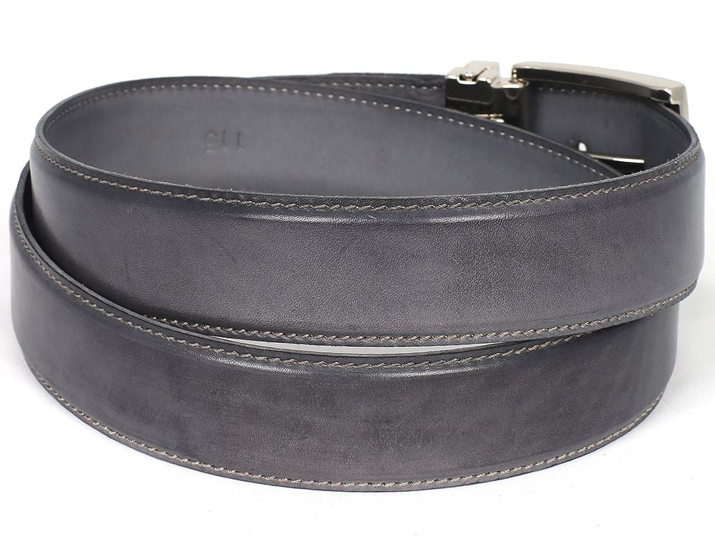 The Paul Parkman Leather Belt Hand-Painted Gray - B01-GRAY is a sophisticated dark Italian calfskin leather belt, complete with a metal buckle and a delicately engraved logo on the strap. This exquisite made-to-order product offers multiple adjustment holes and boasts unmatched quality and style.