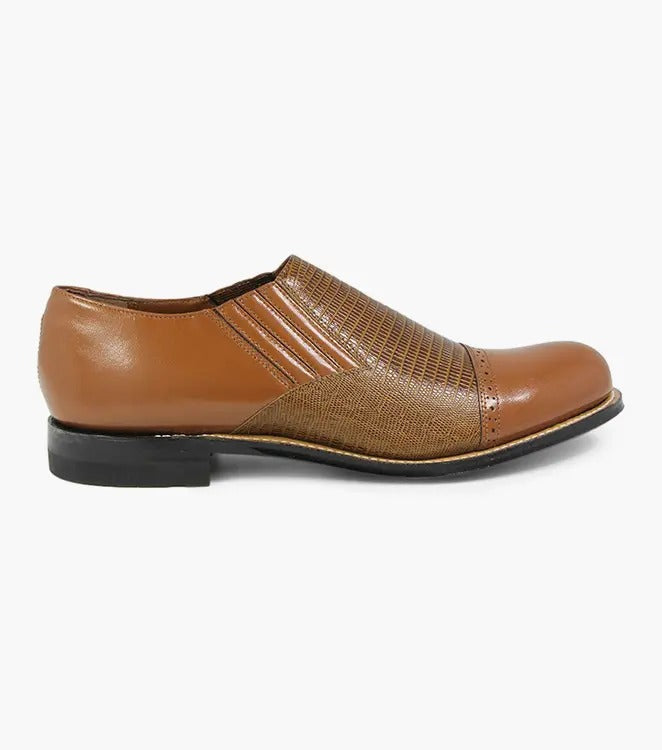 The Stacy Adams MADISON Cap Toe Slip On in tan, model 00067-240, features a textured upper with elastic side panels and boasts Goodyear welt construction for enhanced durability.