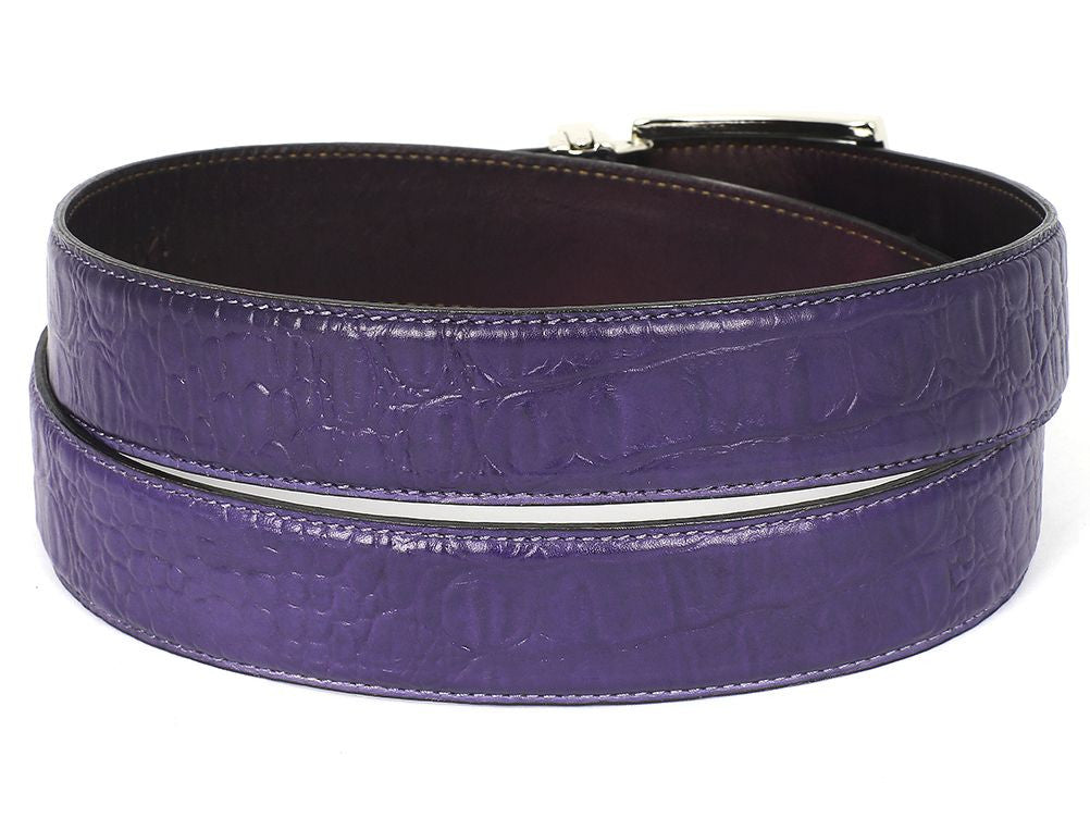 The Paul Parkman Crocodile Embossed Calfskin Leather Belt in Hand-Painted Purple, featuring a silver buckle, is coiled neatly.