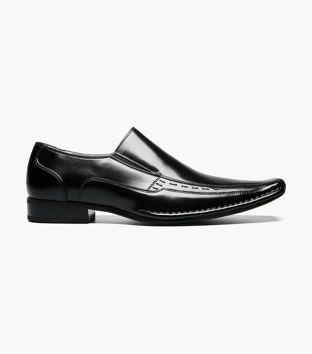 The Stacy Adams - TEMPLIN Bike Toe Loafer in black, designed by STACY ADAMS and identified with model number 24507-001, is a genuine leather shoe boasting a shiny finish and subtle stitching details. It features a cushioned insole for ultimate comfort and is showcased on a plain white background.