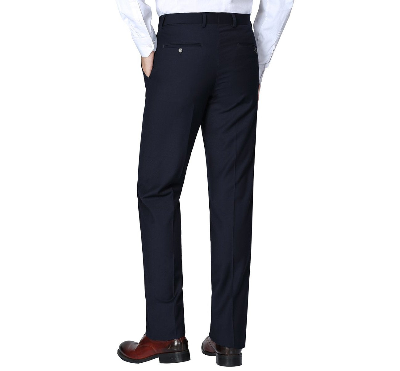 A person wearing a white shirt, Renoir's Alessandro Vitello dark navy classic fit flat front suit separate pants, and brown shoes stands on a plain white background.