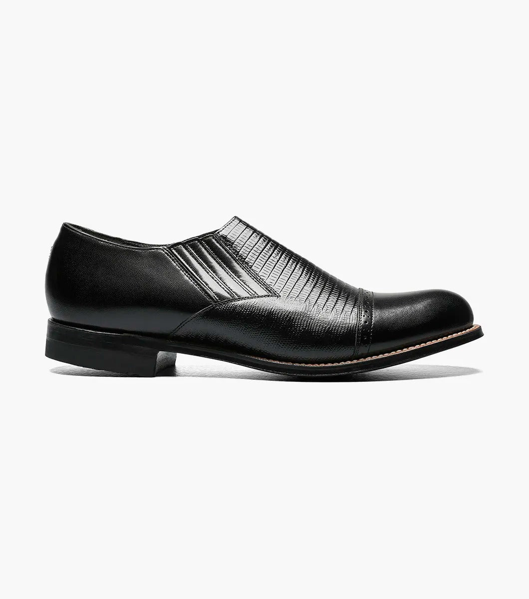 Stacy Adams' MADISON Cap Toe Slip On in black, model 00067-001, is crafted from premium kidskin leather and features textured detailing with a glossy finish.