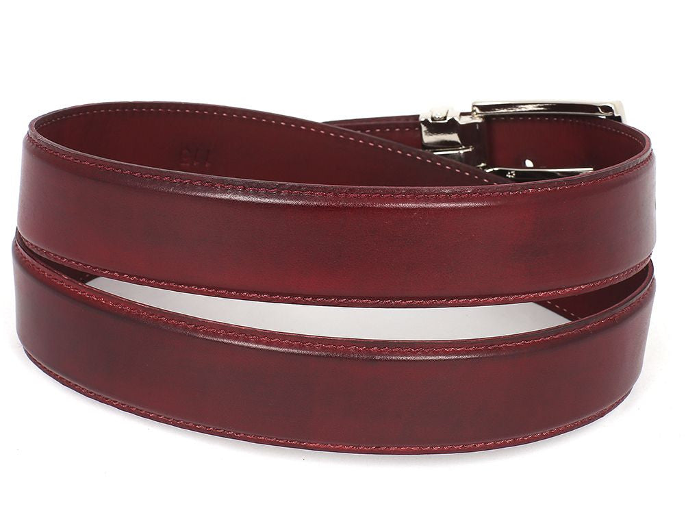 The Paul Parkman Leather Belt Hand-Painted Bordeaux - B01-BRD by Paul Parkman is an exquisite red accessory made from luxurious Italian calfskin leather. It features a silver rectangular buckle and multiple holes for adjustment, offering the perfect blend of style and personalization.