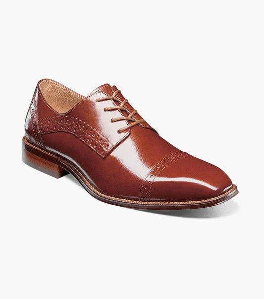 Introducing the Stacy Adams - GARRETT Cap Toe Oxford in Cognac (style number 25543-221) featuring brogue detailing, Buffalo leather upper, and classic laces, set against a white background.