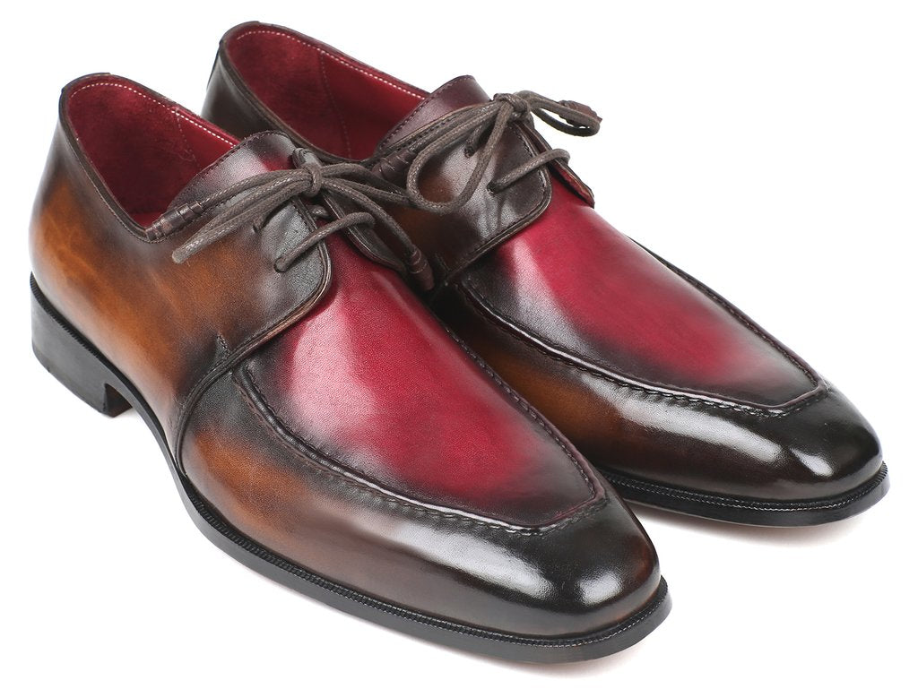 The Paul Parkman Brown & Bordeaux Dual Tone Apron Derby Shoes - 33BB12 are polished dress shoes crafted from calfskin leather in brown and red tones, featuring laces and an artful hand-painted finish displayed at an angle.