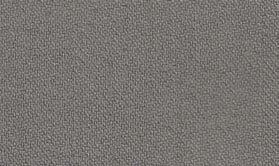 A close-up of a textured gray surface mimics the tightly woven, uniform appearance typical of Inserch's Regular Fit Two Pleat T/R Pant P1199S-33 Grey, reminiscent of trousers crafted from a durable poly-rayon blend.