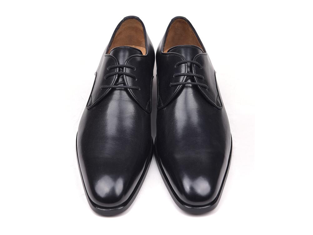 A pair of Paul Parkman Black Leather Derby Shoes - 34DR-BLK in Italian calfskin, featuring classic lace-up styling, with one shoe upright and the other on its side to display the sole.