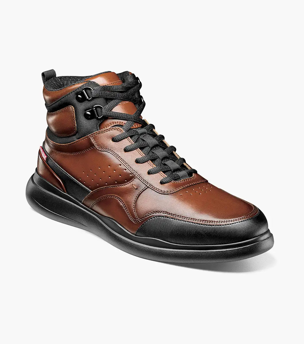 The Stacy Adams MAYSON U-Bal Lace Up Sneaker in Cognac features a brown and black high-top design with black laces and a sturdy yet lightweight EVA sole.