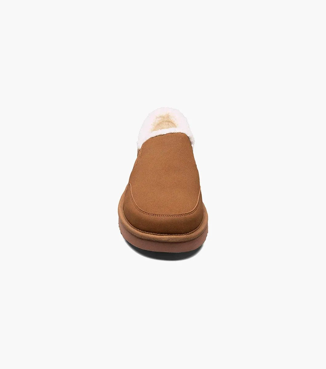 The Stacy Adams - COZE Moc Toe Slip On - Tan Multi - 25558-238, from STACY ADAMS, boasts a textured fabric exterior and soft faux shearling lining. It features a cushioned insole and a brown rubber sole.