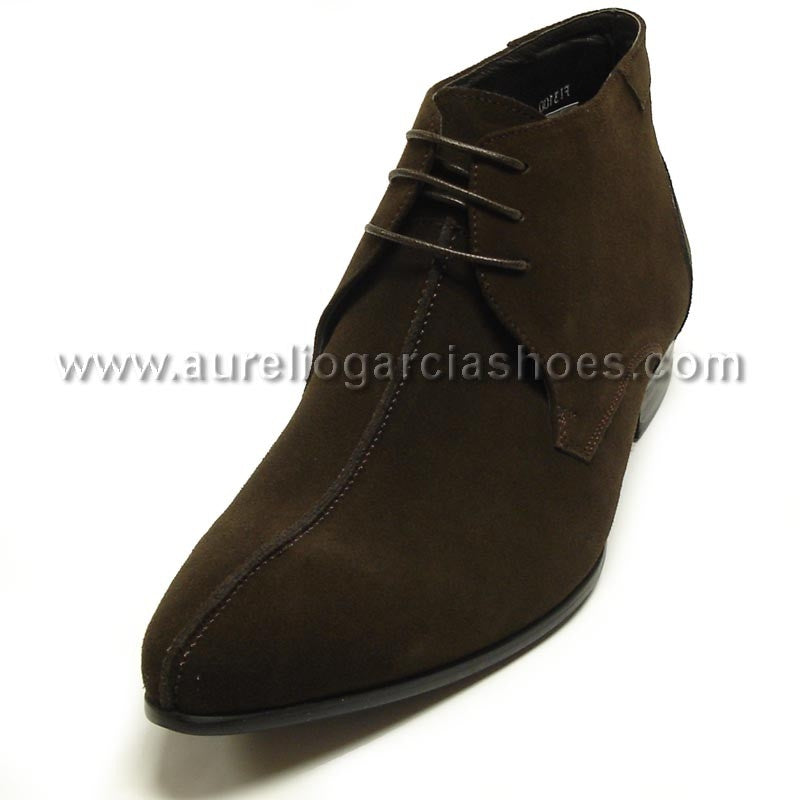 FI-3100 Coffee Suede Encore By Fiesso is a stylish ankle fashion boot from the brand Fiesso, featuring a sleek suede design with laces, detailed stitching, and a cushioned insole for enhanced comfort.