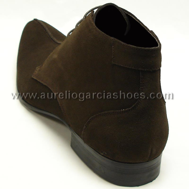 FI-3100 Coffee Suede Encore By Fiesso is a stylish ankle fashion boot from the brand Fiesso, featuring a sleek suede design with laces, detailed stitching, and a cushioned insole for enhanced comfort.