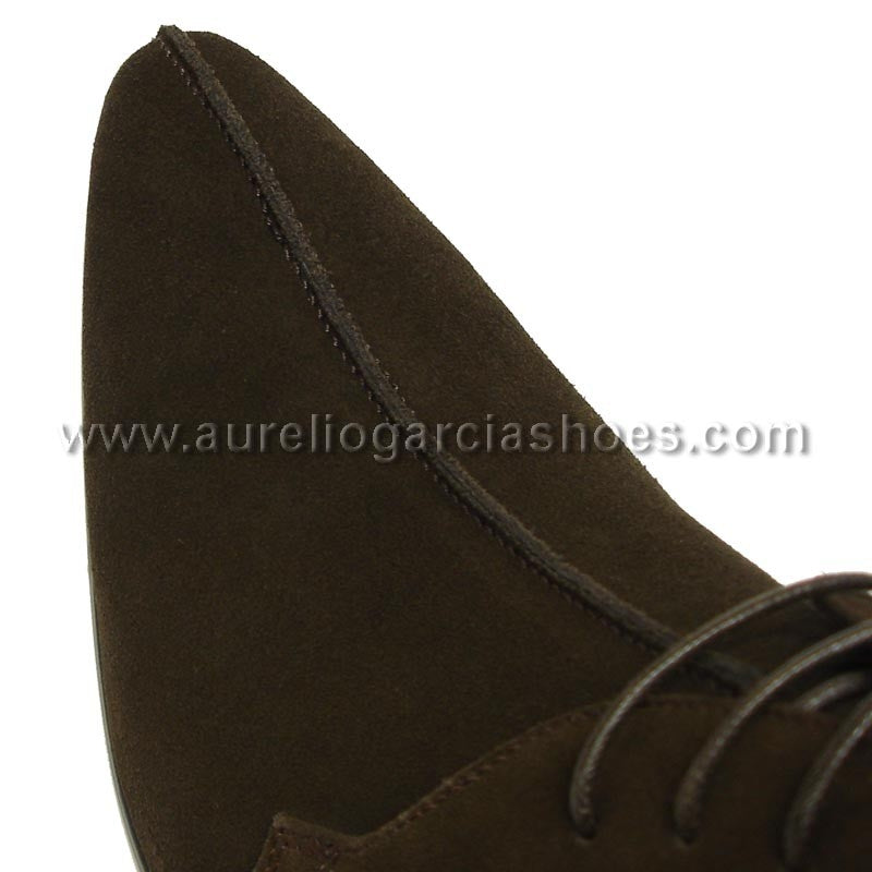 FI-3100 Coffee Suede Encore By Fiesso is a stylish ankle fashion boot from the brand Fiesso, featuring a sleek suede design with laces, detailed stitching, and a cushioned insole for enhanced comfort.