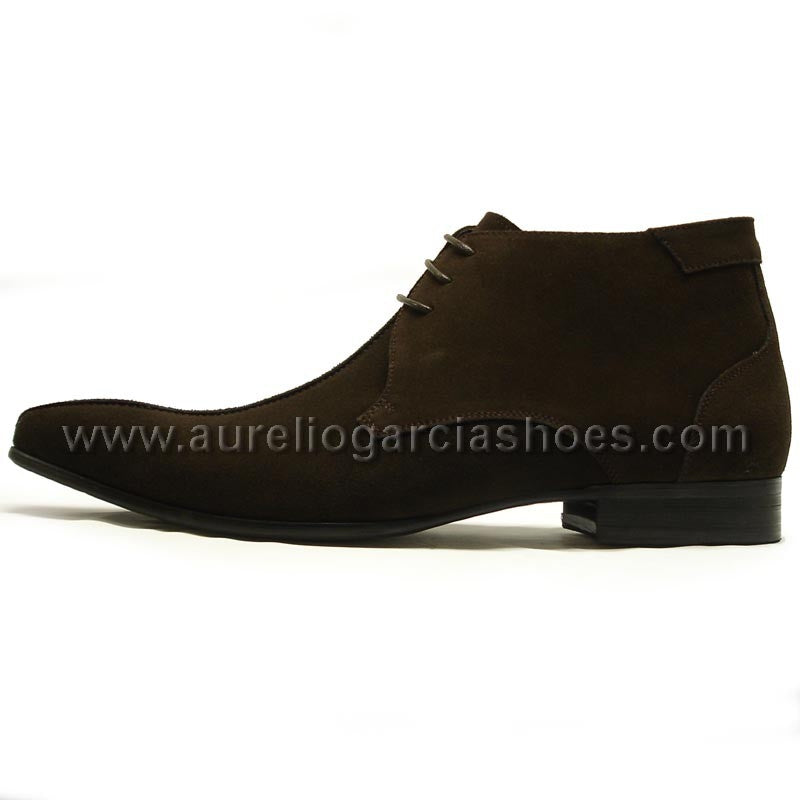 FI-3100 Coffee Suede Encore By Fiesso is a stylish ankle fashion boot from the brand Fiesso, featuring a sleek suede design with laces, detailed stitching, and a cushioned insole for enhanced comfort.