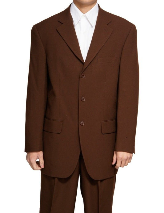 A person in a Vinci Regular Fit 2 Piece 3 Button Suit (Brown) by Vinci Suits, paired with a crisp white shirt and double pleated pants that extend from the shoulders down to their un-hemmed bottoms.