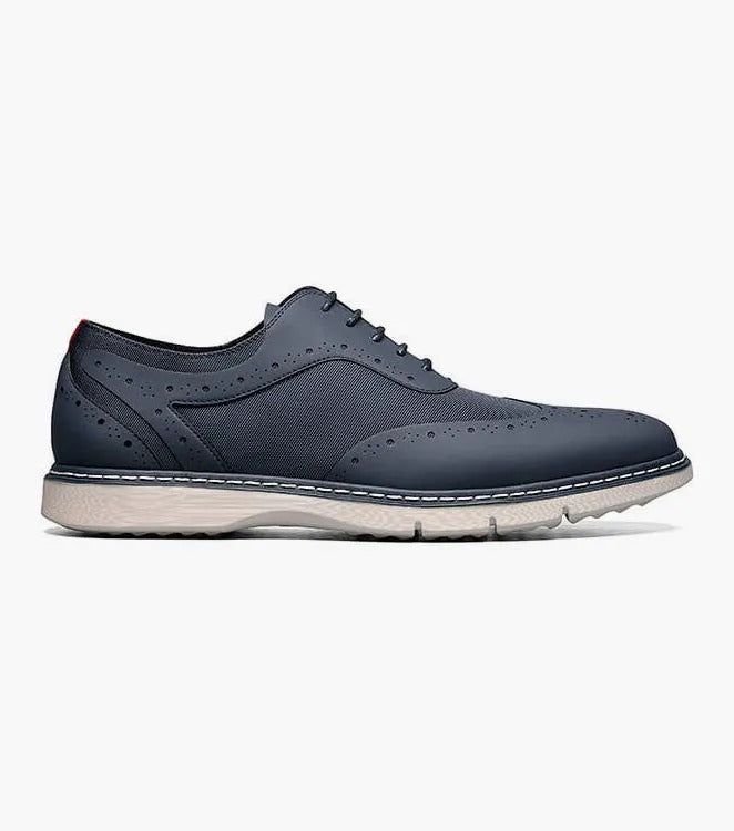 A single Stacy Adams - SUMMIT Wingtip Lace Up shoe in navy, featuring perforated leather with a white sole and wingtip design, viewed from the front.