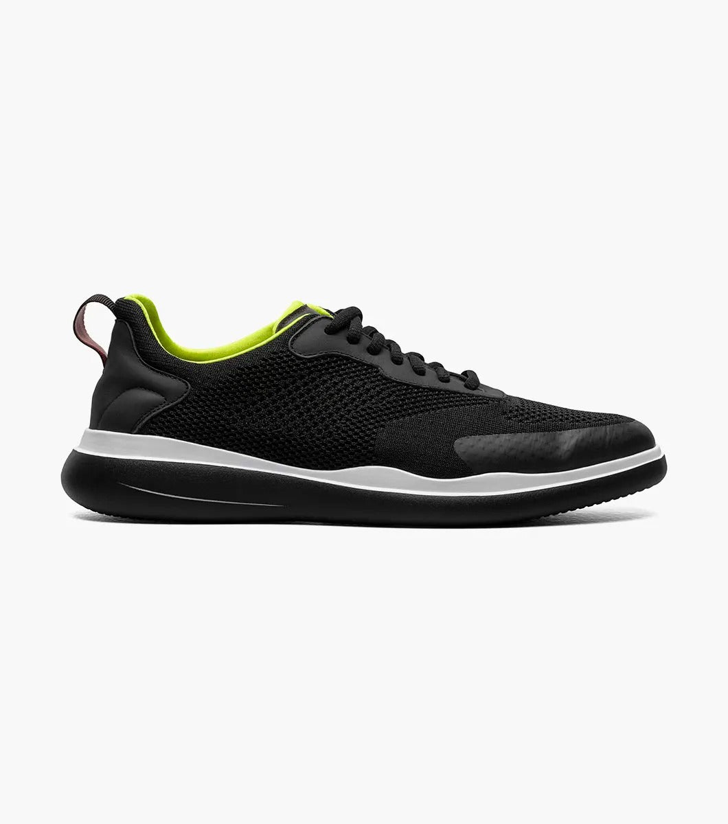 Introducing the Stacy Adams - MAXSON Moc Toe Lace Up Sneaker in black (25517-001) by STACY ADAMS. This stylish sneaker showcases a mesh upper, complemented by a vibrant green interior and a crisp white midsole. Designed for comfort, it features an athletic sole for an easy stride, along with a handy heel pull-tab and coordinating black laces.