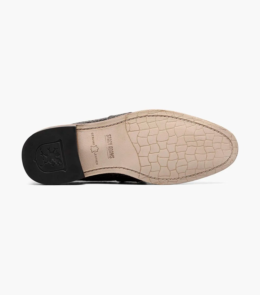 From the Stacy Adams PACETTI collection, this black leather Moc Toe Tassel Slip On loafer features a textured finish, memory foam insole, and brown sole against a white background.