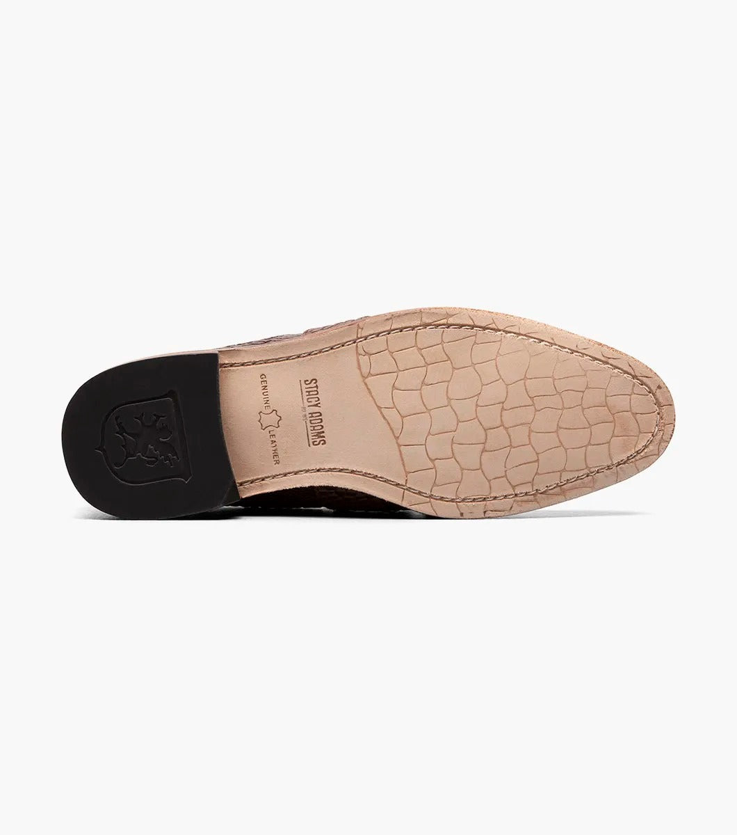 The Stacy Adams - PACETTI Leather Sole Moc Toe Tassel Slip On in Cognac, featuring a textured pattern with tassels on the front and a comfortable memory foam insole, is displayed against a plain white background.