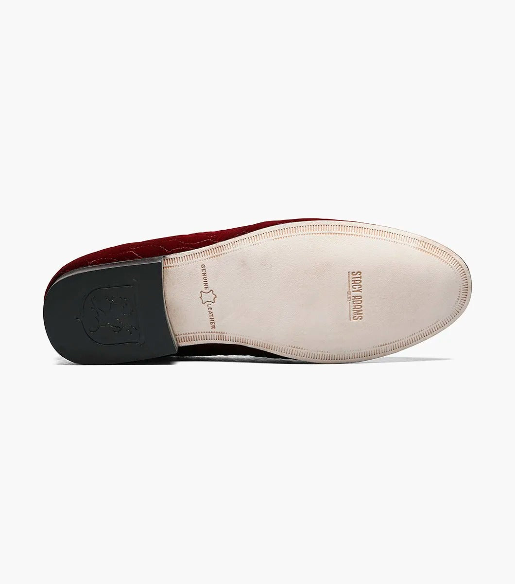 Introducing the Stacy Adams VALET Slip-On Bit Loafer in Burgundy (Product Code: 25166-601), this stylish footwear features a red velvet quilted pattern and is adorned with a gold emblem on the front. Crafted by STACY ADAMS, it boasts a genuine leather sole and incorporates a memory foam insole for enhanced comfort.