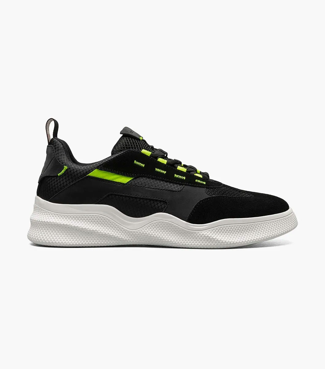 The Stacy Adams Ventura T-Toe Lace Up Sneaker in Black Multi, model 25514-009, combines black and green hues with a white sole for a stylish sneaker design set against a simple backdrop. Crafted for maximum comfort, it incorporates the cutting-edge RedZone removable footbed to make each step feel perfect.