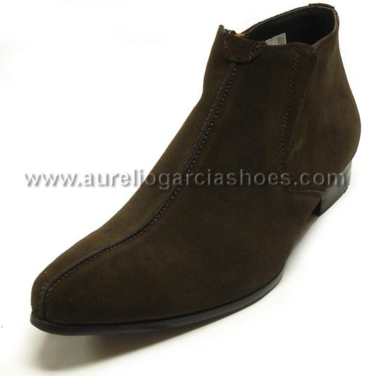 The FI-3101-S Brown Suede Encore By Fiesso fashion boot from the brand Fiesso is an ankle boot featuring a leather upper, pointed toe, low heel, and visible stitching for added elegance.