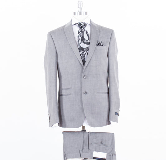 An Andrew Fezza Grey Slim Fit Suit (FAER2FAV0171) paired with matching trousers, complemented by a crisp white shirt and a patterned black and white tie, all meticulously displayed on a mannequin.