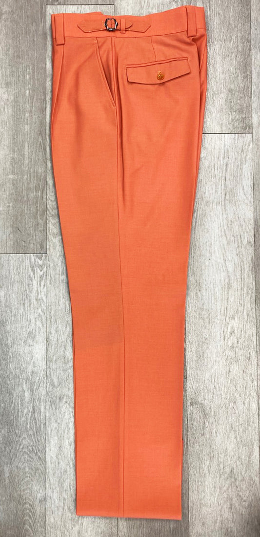 The Tiglio Luxe Marbella Solid Coral Wide Leg Pants TIG4502/1, available in sizes 32 & 50, are crafted from fine wool and feature a belt, buttoned pocket, and pleated front, laid flat on a wooden floor.