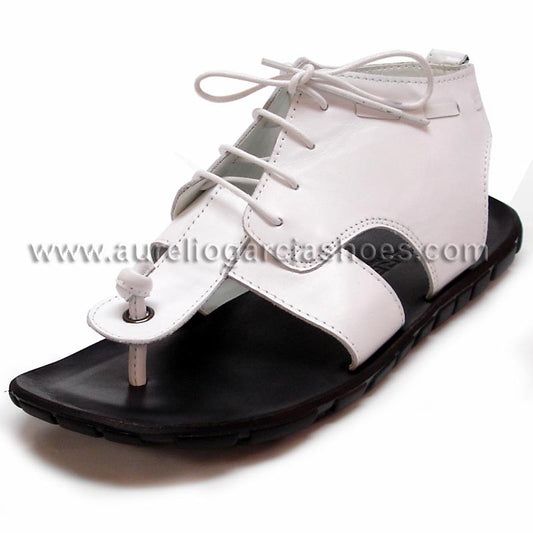 The FI-4045 White Encore By Fiesso from the brand Fiesso is a white and black high-top sandal with open toes, laces, and a flat sole. It boasts a modern design and includes a cushioned insole for ultimate comfort.