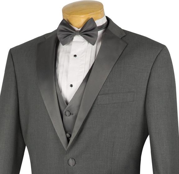 The Vinci Suits regular fit tuxedo, styled as the 4 Piece Tuxedo with Vest Bow Tie in Gray (model 4TV-1), features a sophisticated combination of a gray suit with black satin lapels, complemented by a crisp white dress shirt and a sharp black bow tie. This wrinkle-resistant ensemble is elegantly displayed on a mannequin against a plain background.