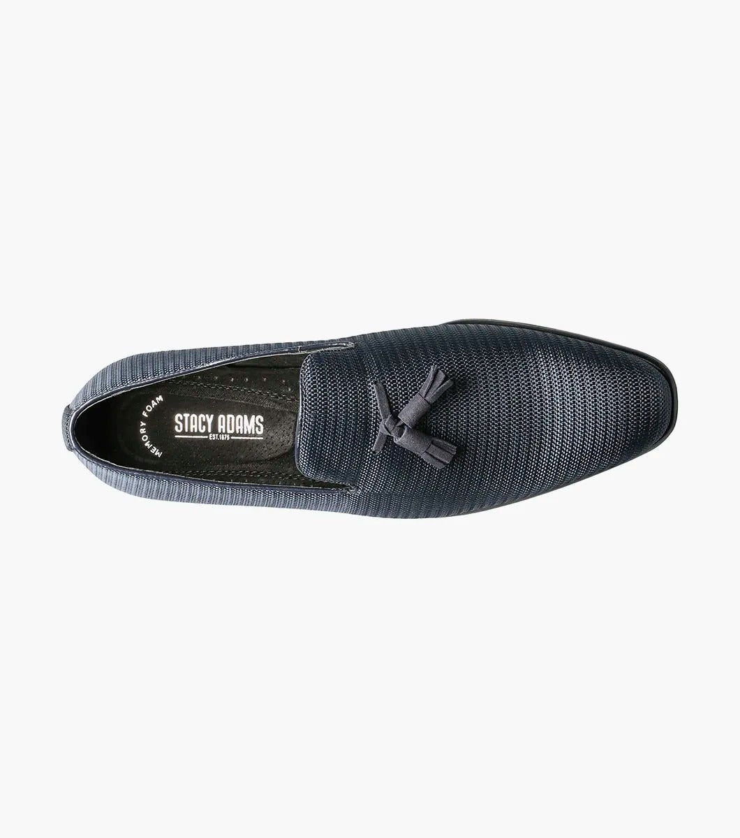 Here's a revised version of the sentence using the provided product data:

A single navy Stacy Adams TAZEWELL Plain Toe Tassel Slip-On loafer, identified by its tassel detail and textured finish, viewed from the side. This loafer features a low heel, sleek design, and cushioned footbed for added comfort.