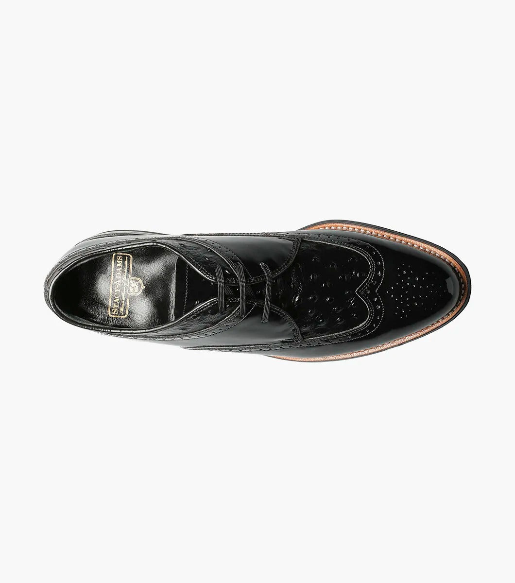 The Stacy Adams - DAYTON Ostrich Wingtip Oxford in black, style number 00375-01, is a single leather dress shoe with decorative perforations and a polished finish. It features laces and a slight heel.