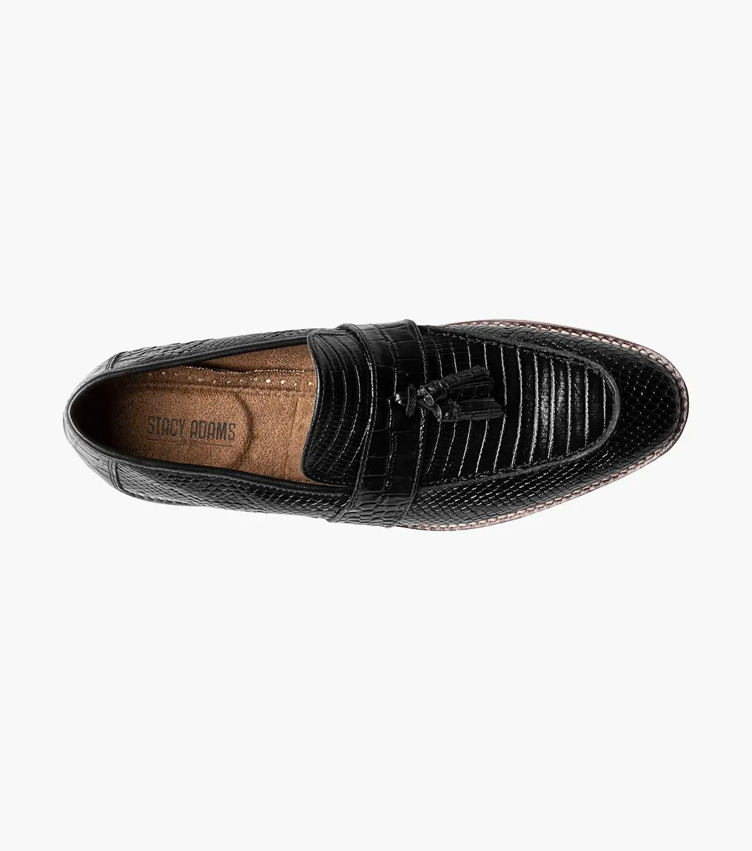 From the Stacy Adams PACETTI collection, this black leather Moc Toe Tassel Slip On loafer features a textured finish, memory foam insole, and brown sole against a white background.